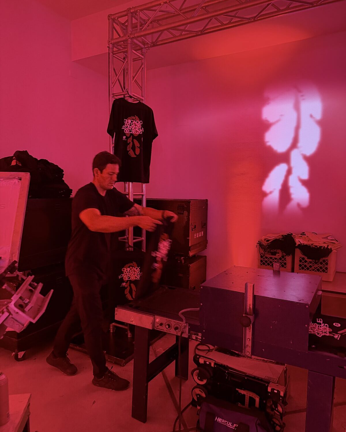 A printer pulling magenta ink across a screen at a live convention booth in Las Vegas