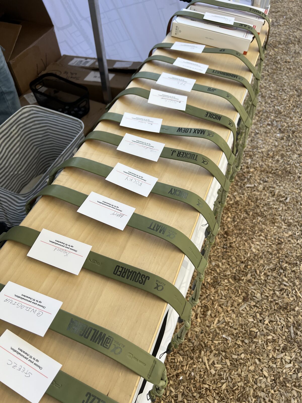 Freshly printed custom merch folded and laid out at a live event